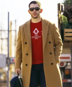 A Very Jonas Christmas Movie 2025 Nick Jonas Brown Coat